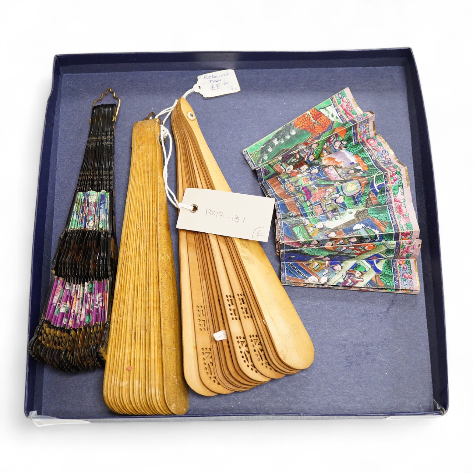 An unusual 19th century Chinese export gilt-decorated tortoiseshell and painted leaf fan, two English fans decorated with paper printed paper crests and a single sided Canton fan leaf lacking sticks, largest 23cm in leng